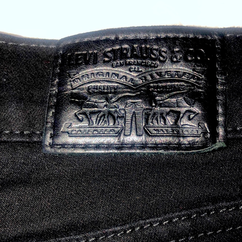 Levi’s black super skinny jeans.